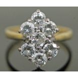 A seven stone diamond ring, total approx. diamond weight 1.40 carats, band hallmarked 18ct gold,