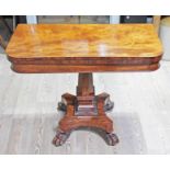 A 19th Century mahogany fold over tea table with hexagonal pedestal with gadrooned detail,