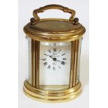 A Rapport brass carriag3 clock, height 10cm.
