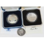 Two silver proof coins and a William IV half crown.