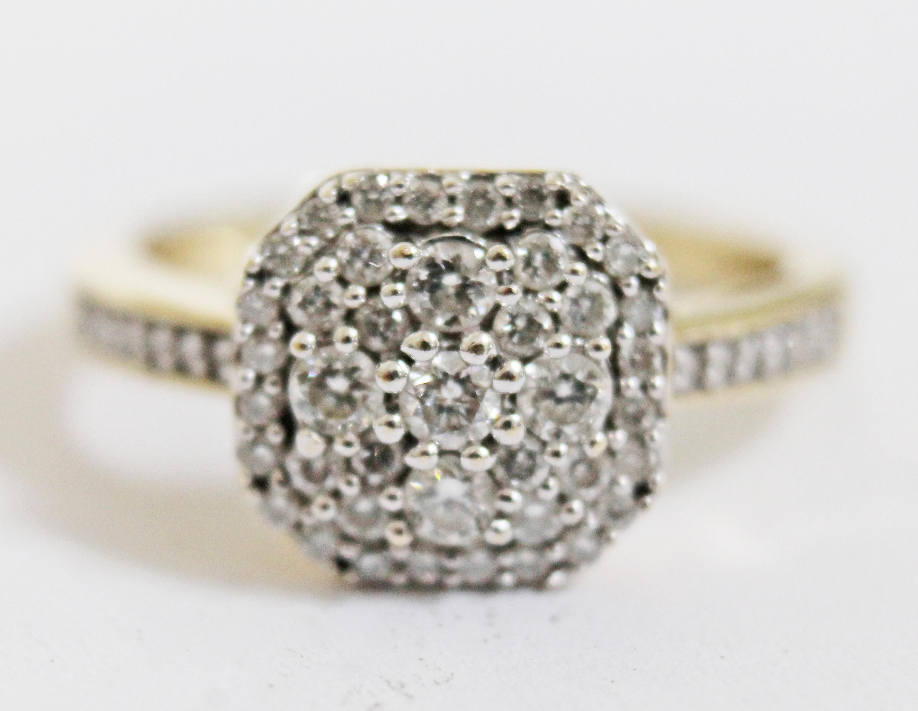 A hallmarked 9ct gold diamond cluster ring, total approx. diamond wt. 0.505 carats, gross wt. 3.