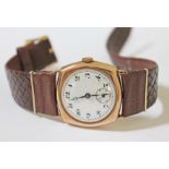 A 9ct gold wristwatch with enamel dial and leather strap, dial width 31mm, with gold plated