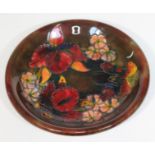 A Moorcroft pottery dish, diam. 21.5cm. Condition - good, no chips, no cracks nor any restoration,