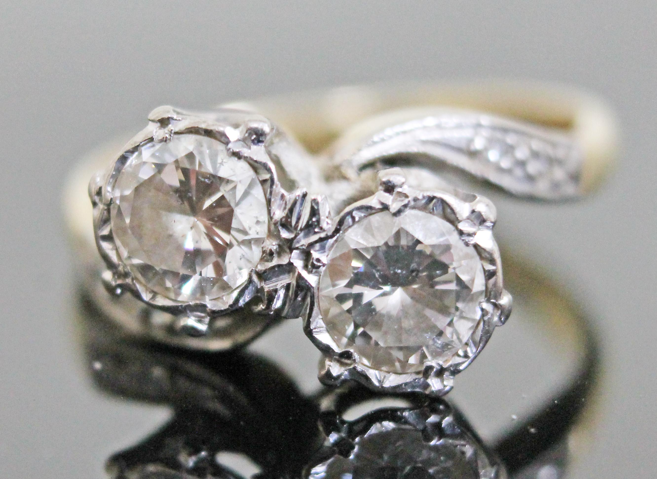 An Art Deco diamond crossover ring, each diamond weighing approx. 0.50 carats, diamond set