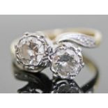 An Art Deco diamond crossover ring, each diamond weighing approx. 0.50 carats, diamond set