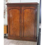 A Victorian mahogany double wardrobe with cornice top, left side with single interior drawer,