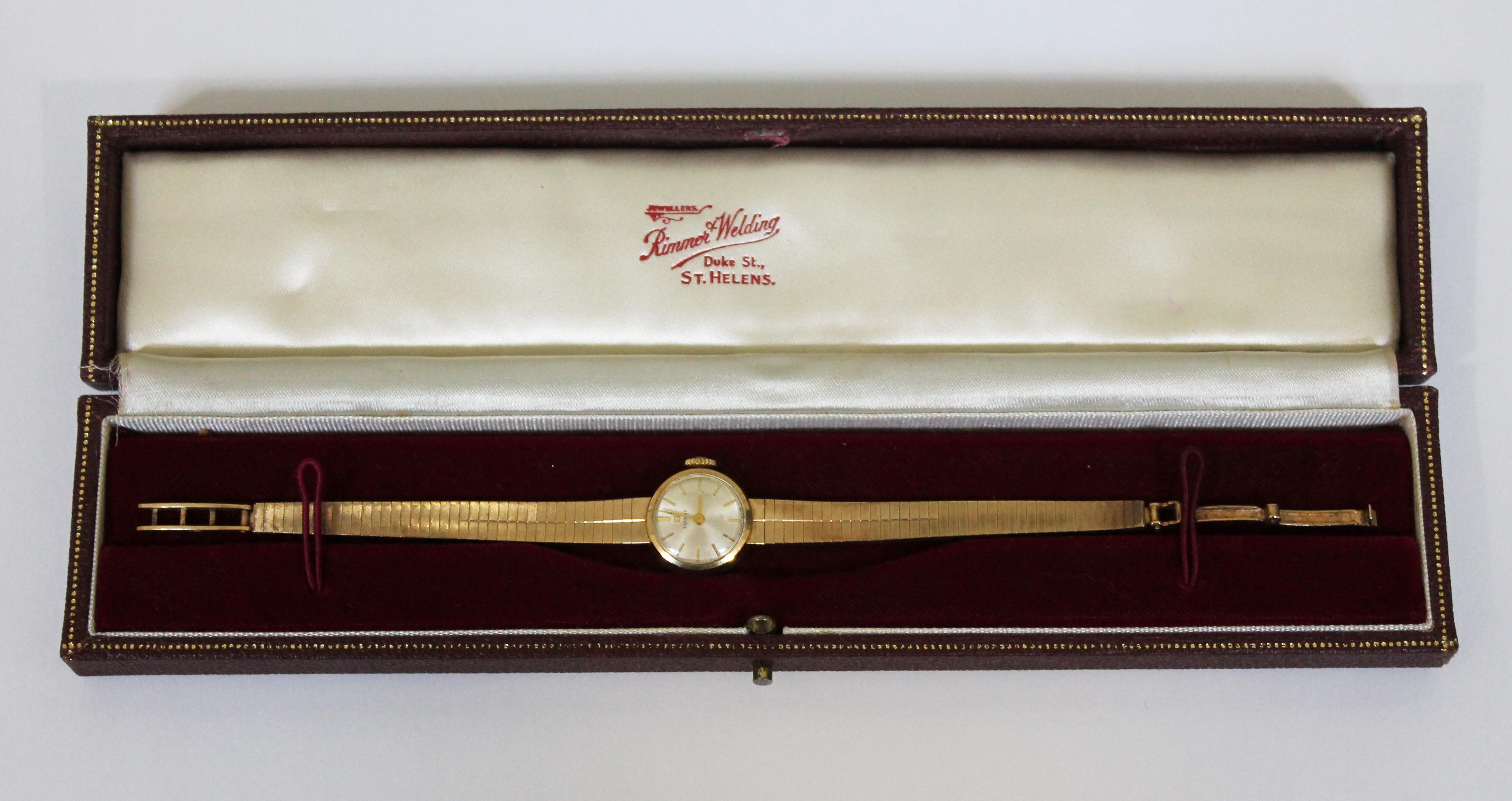 A ladies 9ct gold Tissot wristwatch with 9ct gold strap, gross wt. 14.5g, with associated box.