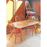 An Ercol elm and beech table and four chairs, table length 153cm, depth 76cm & height 71cm.