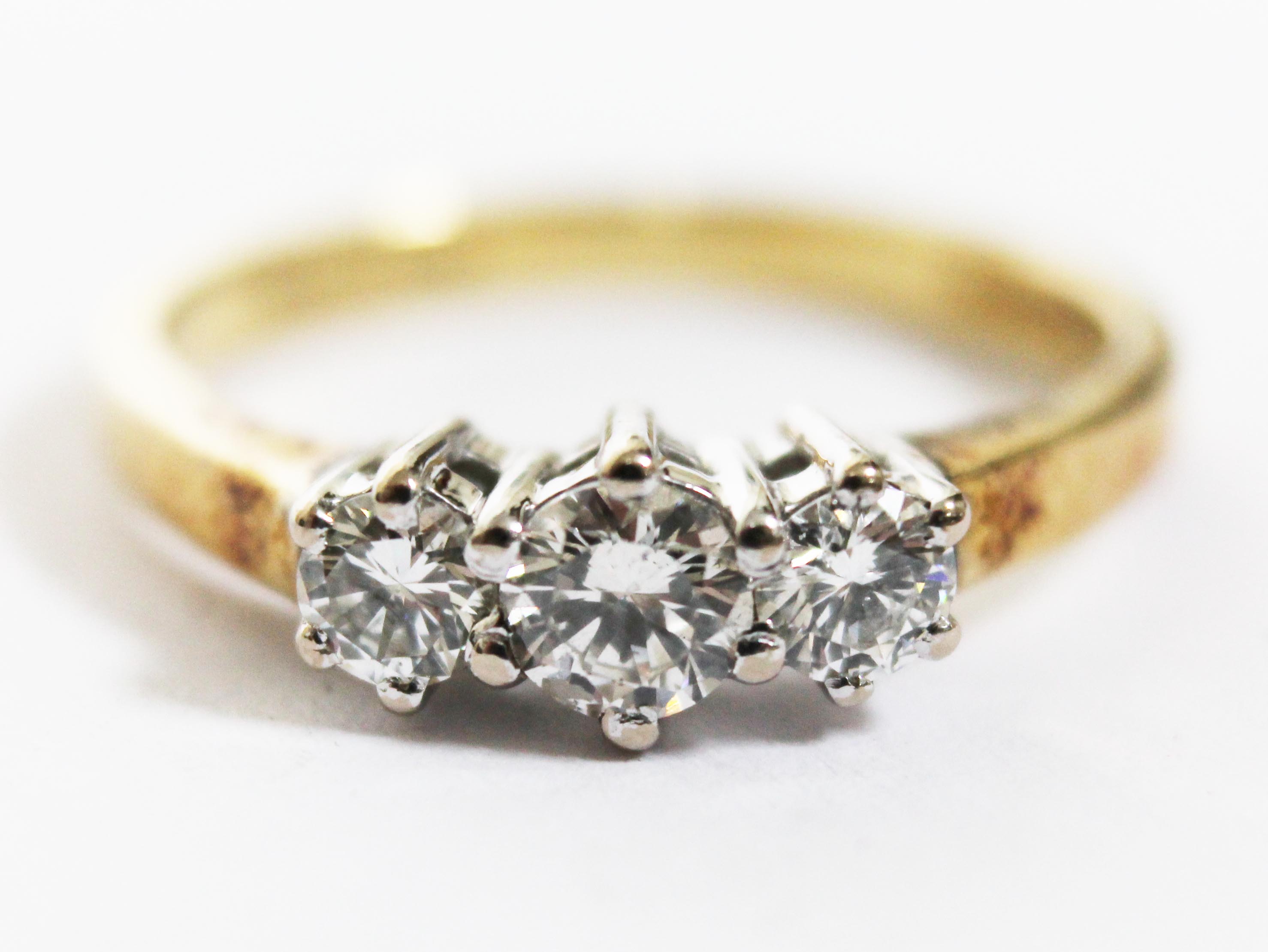 A hallmarked 18ct gold three stone diamond ring, total approx. diamond wt. 0.50 carats, gross wt.