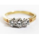 A hallmarked 18ct gold three stone diamond ring, total approx. diamond wt. 0.50 carats, gross wt.