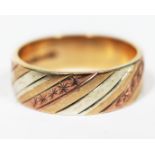 A hallmarked 9ct three colour gold wedding band, wt. 3.8g, size L/M.