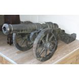 A replica model cannon and carriage, length 140cm.