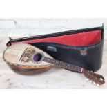 An Italian mandolin with retailers label 'Rushworth Liverpool' and hard case.