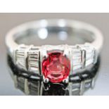 A hallmarked 18ct white gold diamond Tanzanian ruby ring, gross wt. 2.9g, size N, with copy of