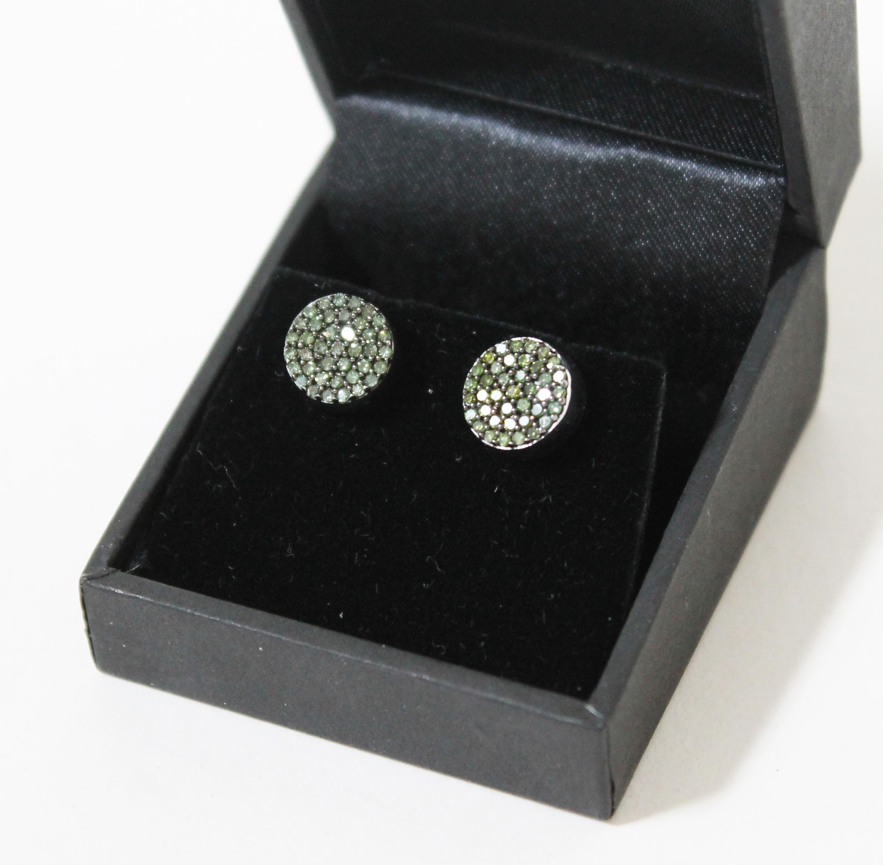 A pair of hallmarked 9ct gold green diamond ear studs, gross wt. 3.3g, with certificate.