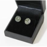 A pair of hallmarked 9ct gold green diamond ear studs, gross wt. 3.3g, with certificate.