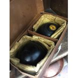 PAIR OF CROWN GREEN BOWLS IN A CARDBOARD BOX