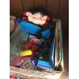 A box containing toys, Die-Cast miniature toys and some books