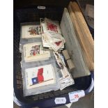 A box containing cigarette cards and albums with Kensitas silks cigarette cards