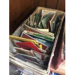 A box containing cigarette cards, match cards, etc