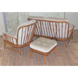 An Ercol elm settee, armchair and pouffe, design 205 in Golden Dawn finish.