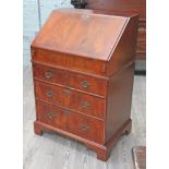 A Queen Anne style walnut bureau, 20th Century, width 70cm, depth 48cm & height 101cm.