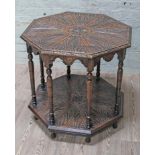 An Edwardian carved oak octagonal two tier table, diam. 80cm & height 74cm.