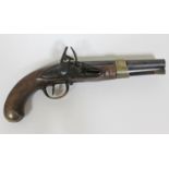 An early 19th Century French military flintlock pistol having brass mounted 3/4 length walnut stock,