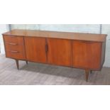 A mid 20th Century retro teak sideboard in the manner of McIntosh, lacking any maker's label,