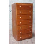 A utilitarian plywood chest of drawers with white plastic knobs, width 53cm, depth 43cm & height