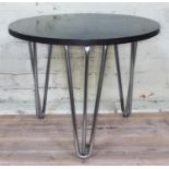 An Art Deco black coffee table with chrome legs, diam. 61cm, height 50cm.