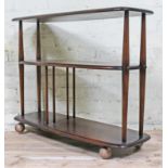 An Ercol elm three tier trolley, height 71cm, width 92cm, depth 32cm.