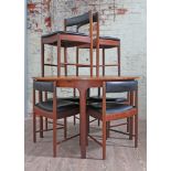 A mid 20th Century McIntosh teak extending round table and 6 chairs, table height 74cm, diameter