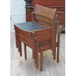 A set of four 1960s stacking teak dining chairs.