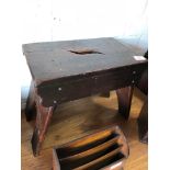 A stained pine stool circa 1900 with cut out handle and arched sides.