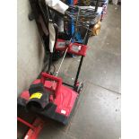 A Mantis electric snow thrower