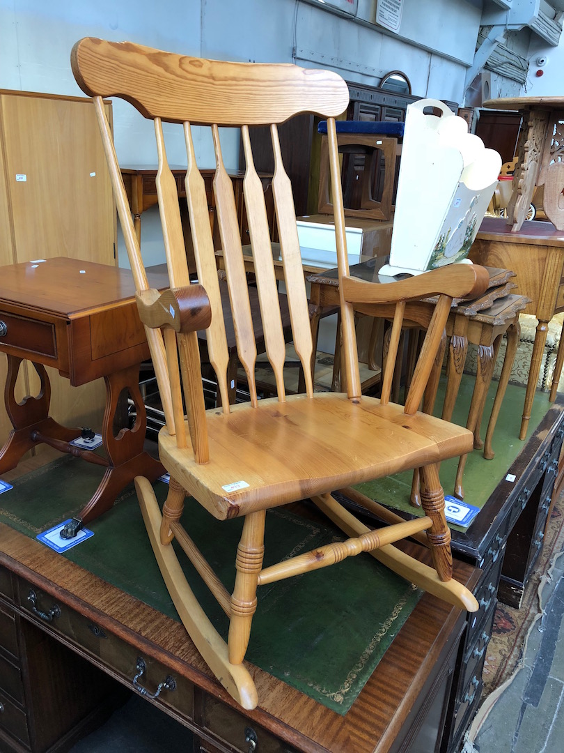 A pine rocking chair.