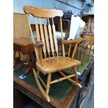 A pine rocking chair.