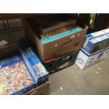 4 boxes of jigsaws and other games