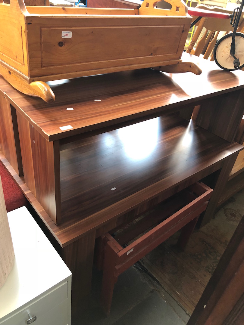 A modern wood effect table and two bench seats.