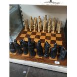 Chess set and large wooden chess board