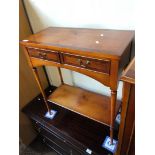 A two drawer yew wood side table.