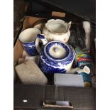 A box of household items including pottery