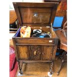 A Sylvaphone gramophone in oak case with records.