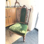 An inlaid Victorian chair.