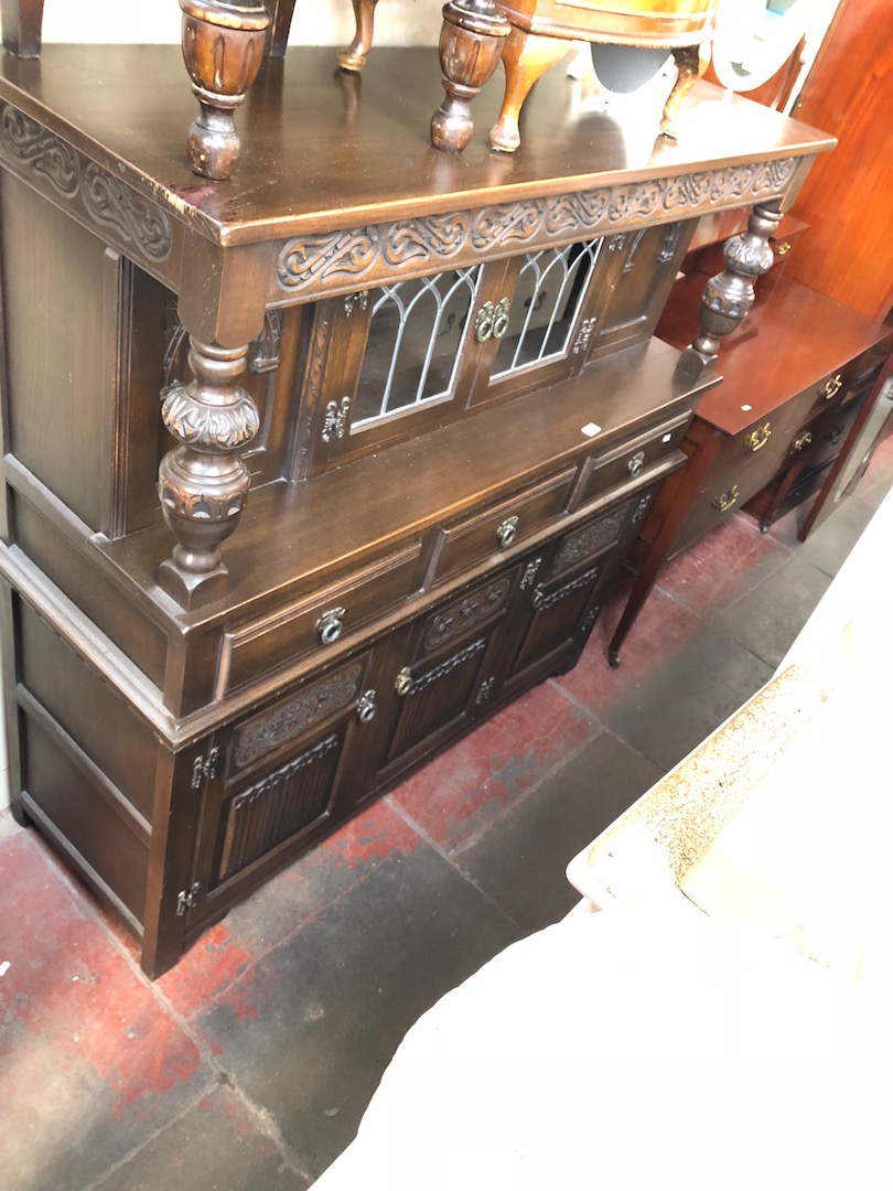 A reproduction oak court cupboard.