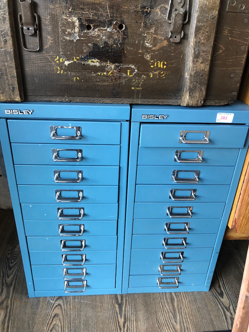 A pair of Bisley blue/grey metal file drawers.