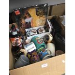 A box of misc including souvenir mugs, Star Wars, etc