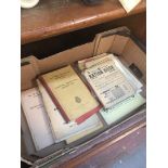 A box containing ration books + wartime advice books