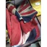 A box containing 2 naval red ensign stitched vintage flags